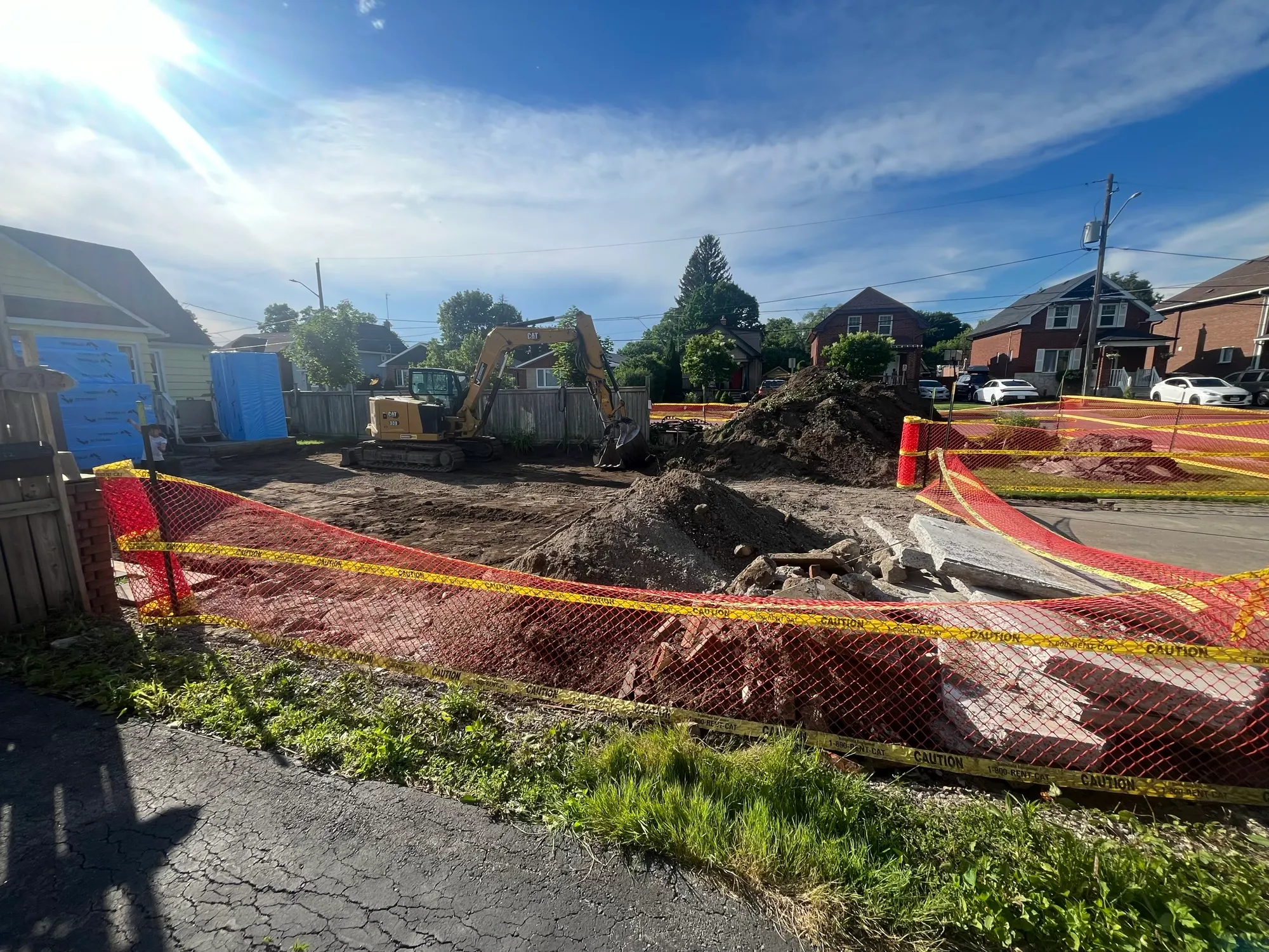 The excavated lot — progress to some, disruption to others